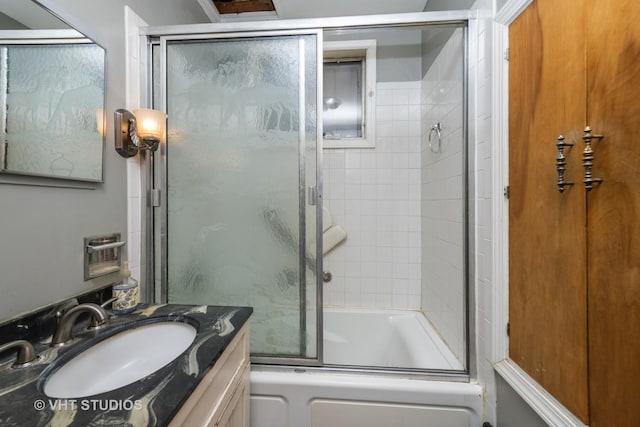 full bath featuring enclosed tub / shower combo and vanity