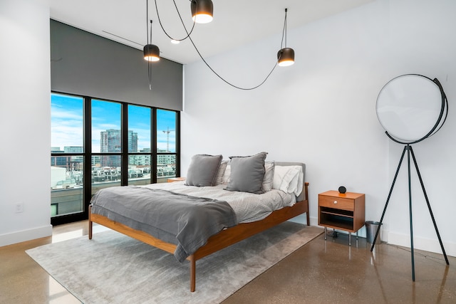 bedroom featuring concrete flooring