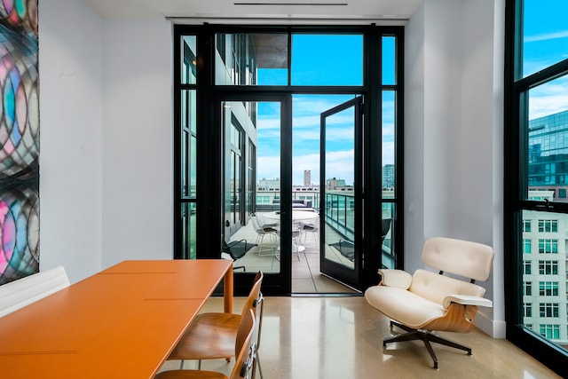 interior space with french doors and a wall of windows