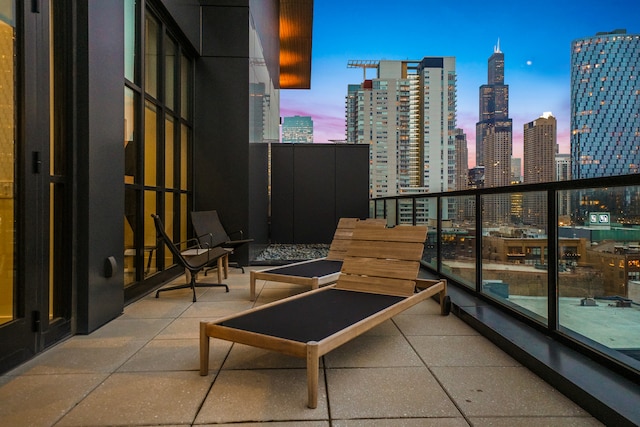 view of balcony at dusk