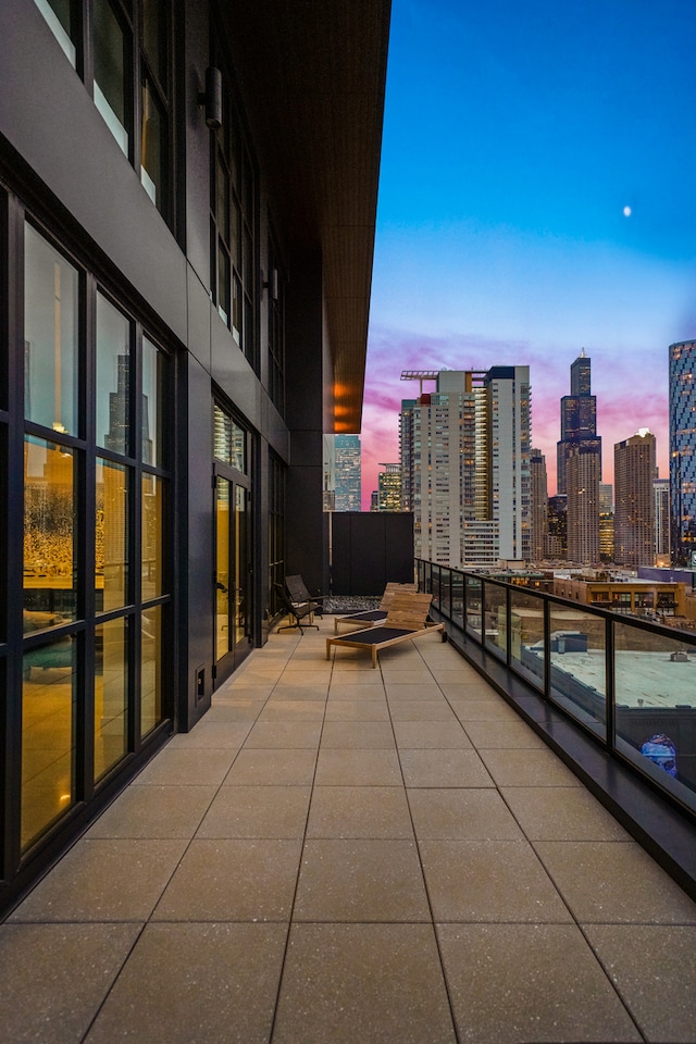 view of balcony at dusk