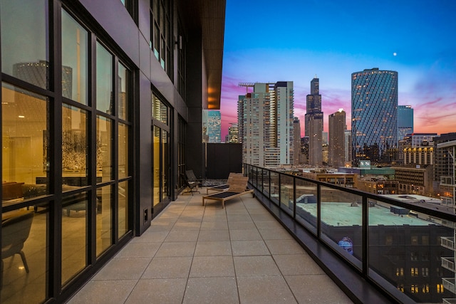 view of balcony at dusk