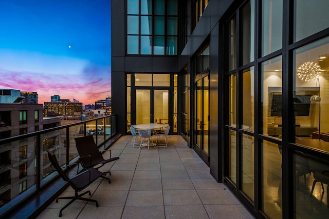 view of balcony at dusk