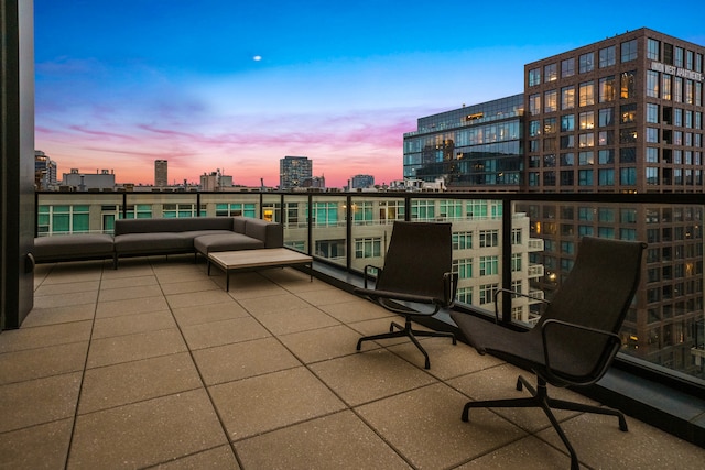 patio terrace at dusk with a balcony