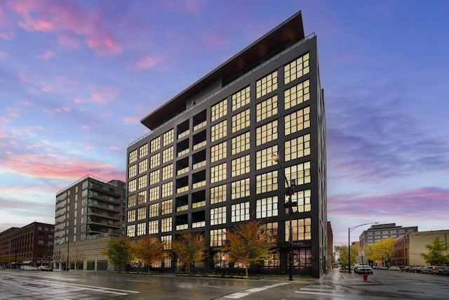 view of outdoor building at dusk