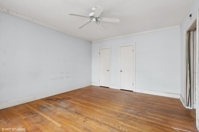 unfurnished bedroom featuring wood-type flooring, crown molding, two closets, and ceiling fan