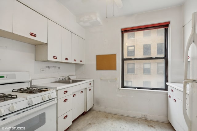 kitchen with ceiling fan, white cabinets, sink, and white appliances