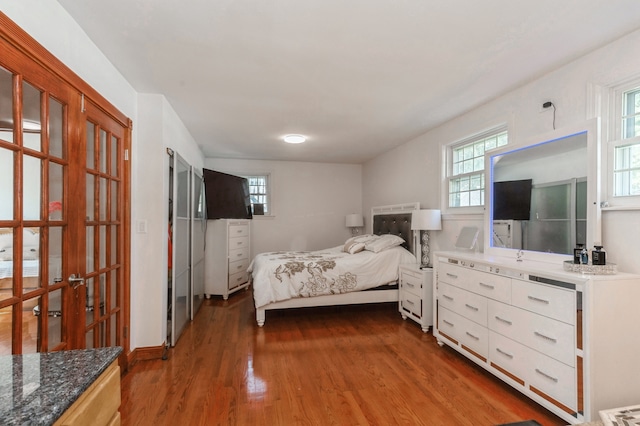 bedroom featuring dark wood-type flooring