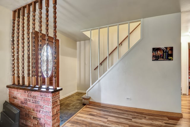 staircase with hardwood / wood-style flooring