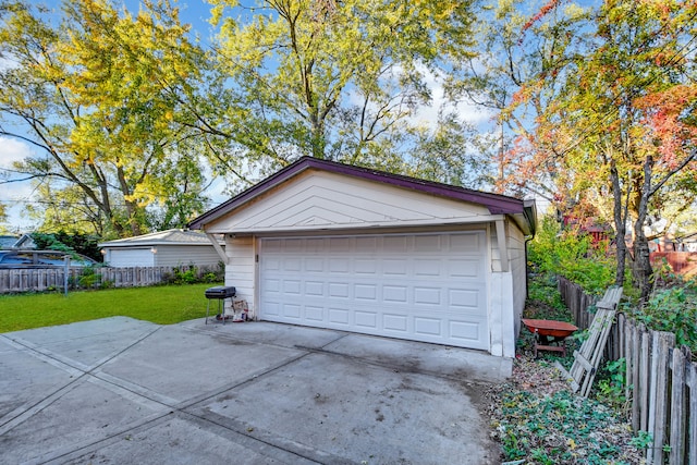 garage featuring a yard