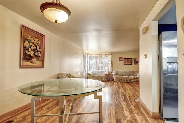 dining room with hardwood / wood-style flooring