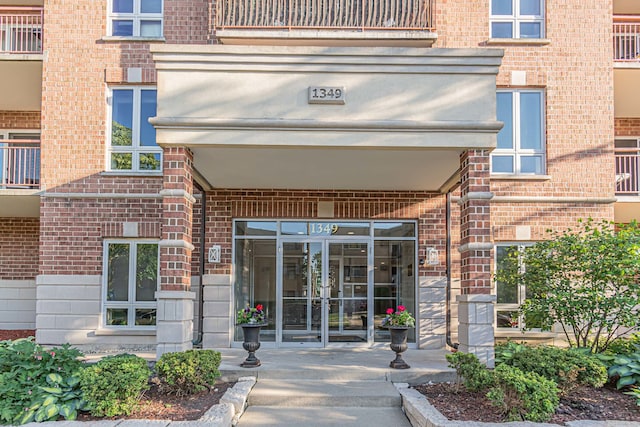 view of exterior entry featuring french doors