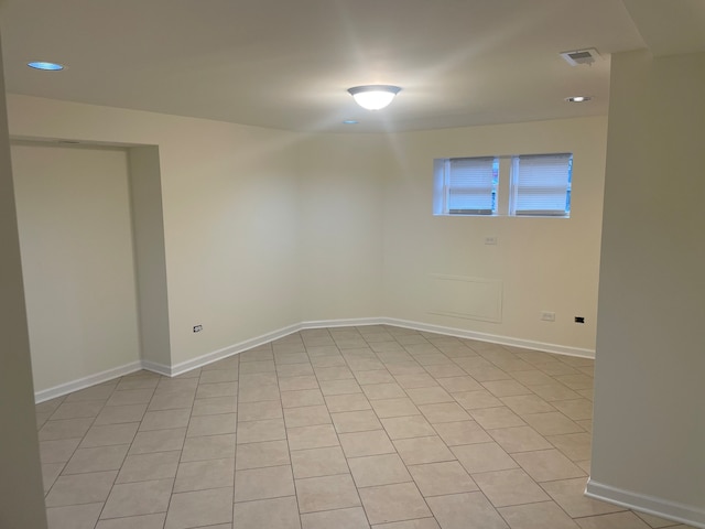 unfurnished room featuring light tile patterned flooring