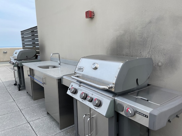 view of patio / terrace with area for grilling and sink