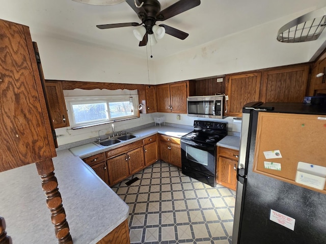 kitchen with ceiling fan, sink, and appliances with stainless steel finishes