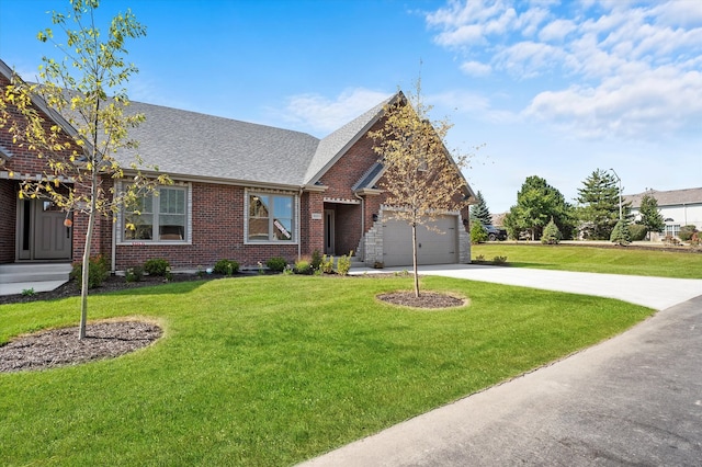 view of front of house with a front yard and a garage