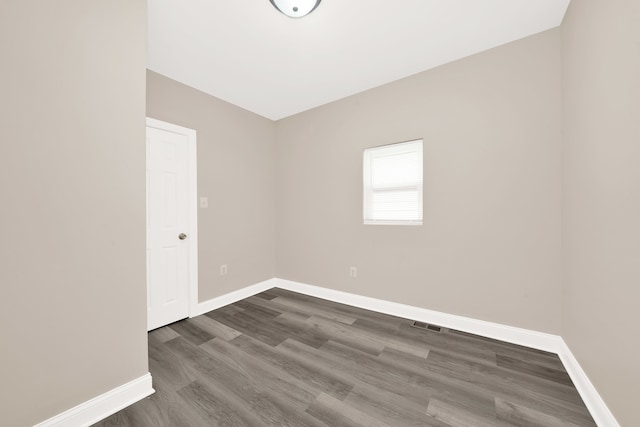 empty room featuring dark hardwood / wood-style floors