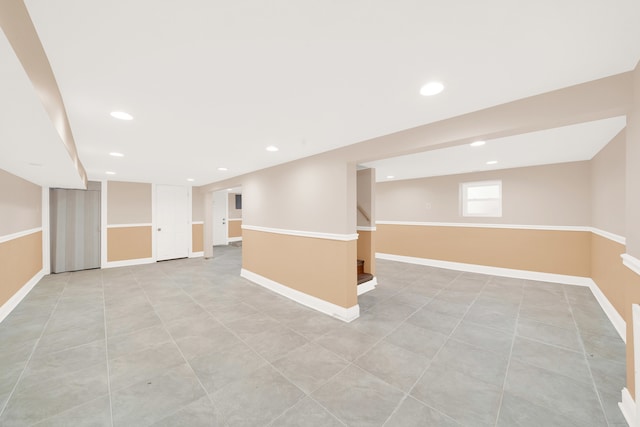 basement featuring light tile patterned floors