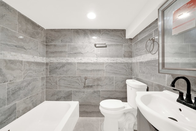 full bathroom featuring tile walls, vanity, toilet, and shower with separate bathtub