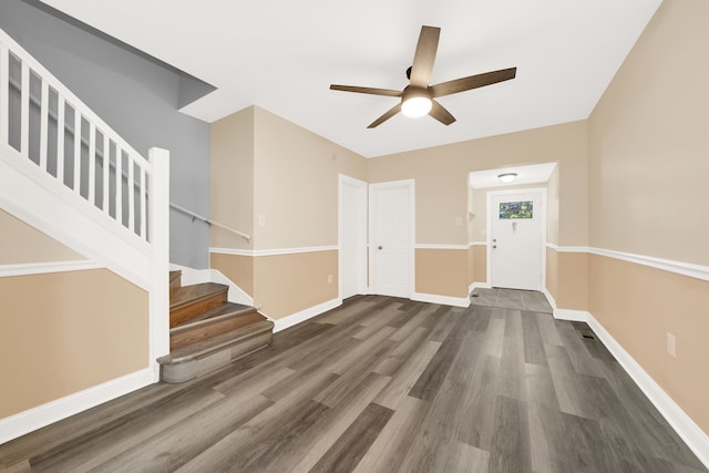 entryway with ceiling fan and dark hardwood / wood-style flooring