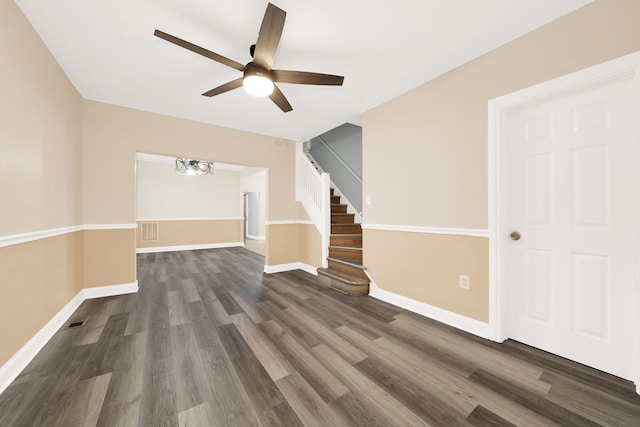 bonus room with ceiling fan and dark hardwood / wood-style floors