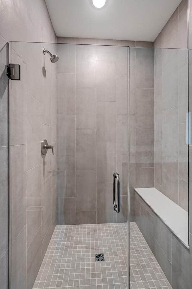 full bath with a shower stall