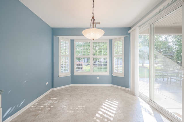 spare room with plenty of natural light