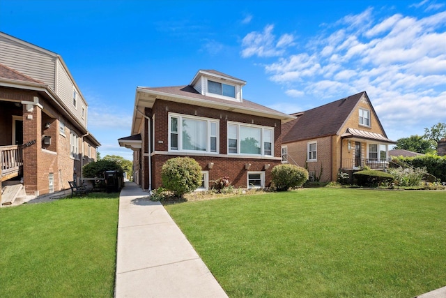 bungalow with brick siding and a front lawn