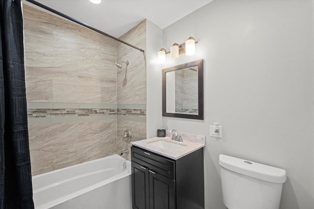 bathroom with shower / washtub combination, toilet, and vanity