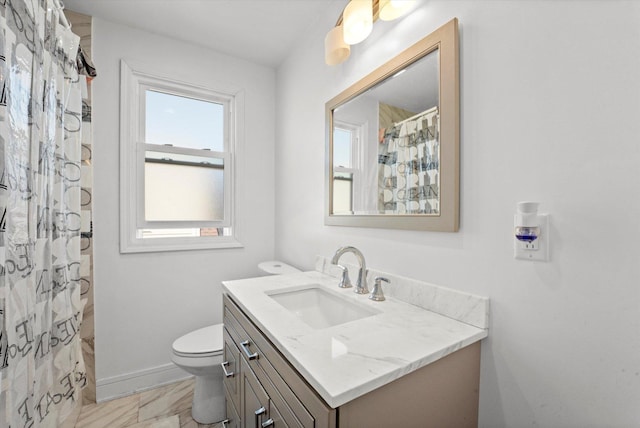 bathroom featuring vanity, toilet, baseboards, and a shower with curtain