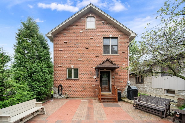 back of property featuring a patio