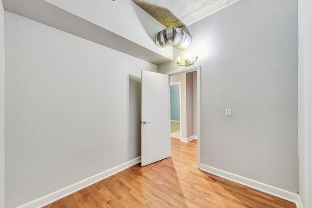 spare room with light hardwood / wood-style floors