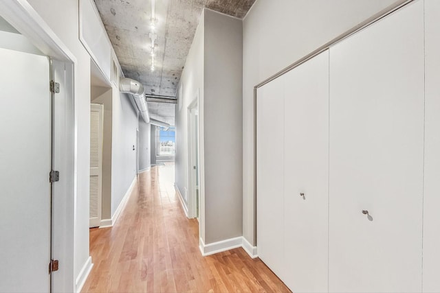 hallway with light wood-type flooring