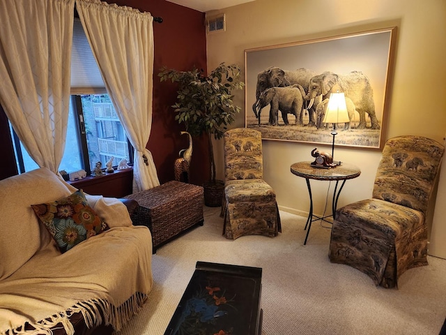 sitting room with visible vents and carpet
