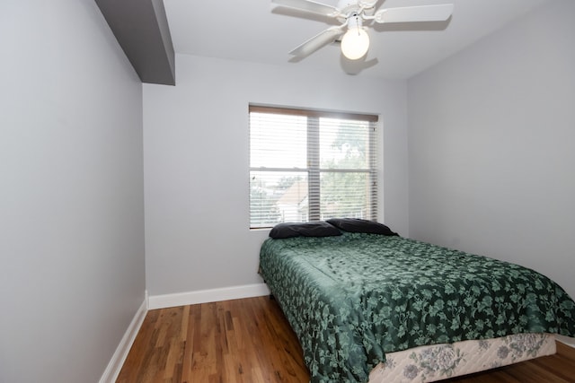 bedroom with wood-type flooring and ceiling fan