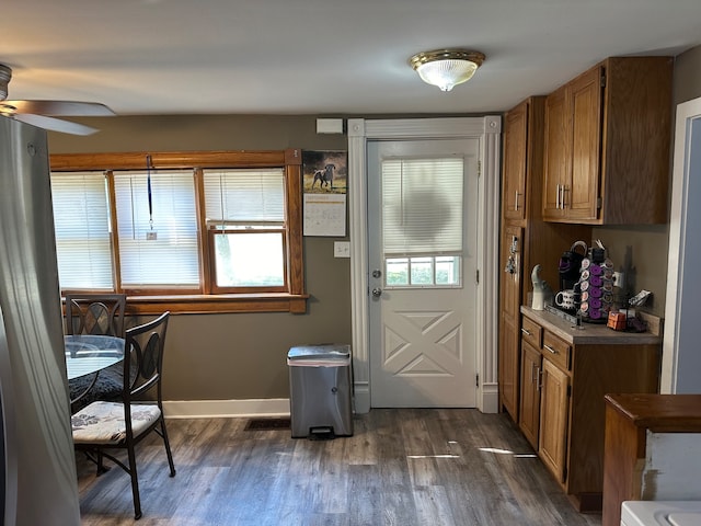 interior space featuring ceiling fan and dark wood-type flooring