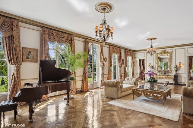 living room with parquet flooring, a chandelier, and crown molding