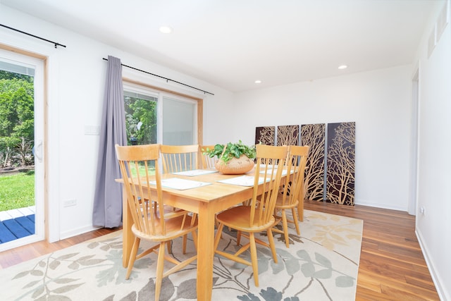 dining space featuring hardwood / wood-style flooring