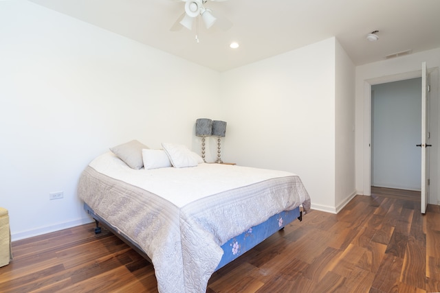 bedroom featuring ceiling fan and dark hardwood / wood-style flooring