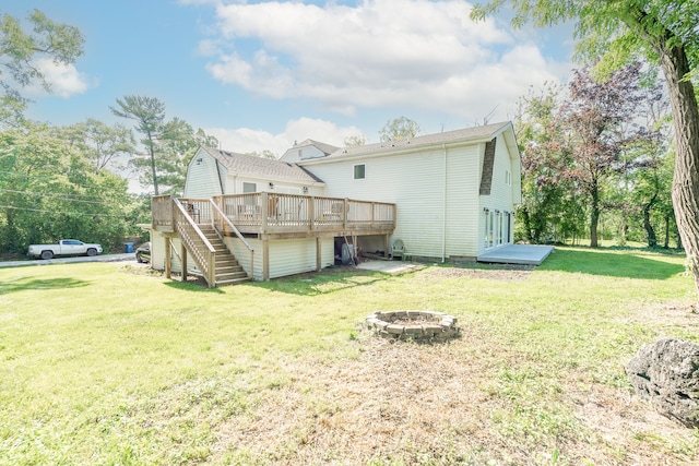 exterior space with a deck and an outdoor fire pit