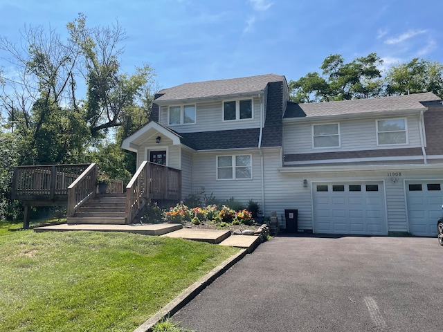 view of front property with a front yard and a garage