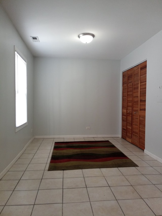 entryway featuring light tile patterned flooring