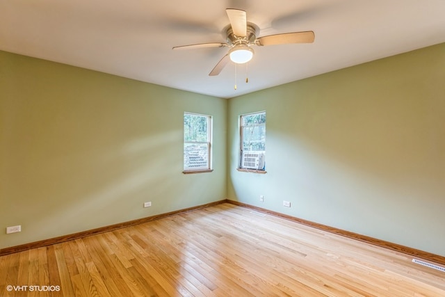 unfurnished room with light hardwood / wood-style flooring and ceiling fan