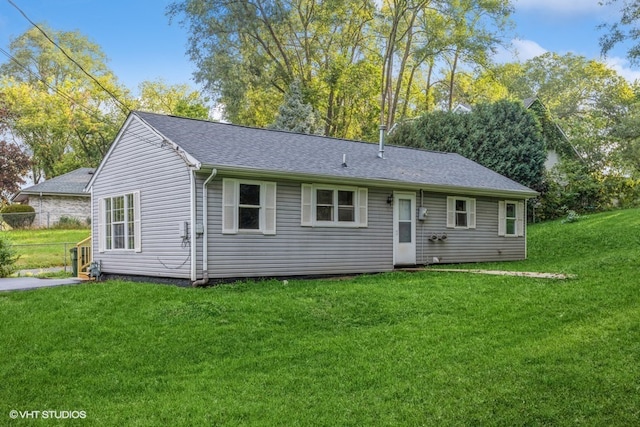 ranch-style home featuring a front yard