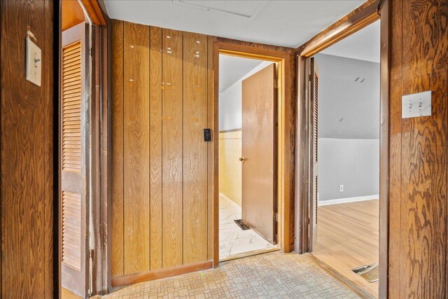 hall with light hardwood / wood-style flooring