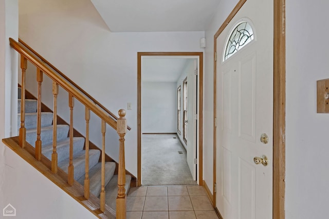 entryway featuring light carpet