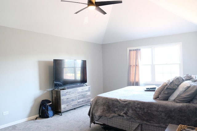 carpeted bedroom with vaulted ceiling and ceiling fan