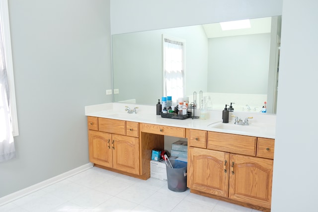 bathroom with vanity and a skylight