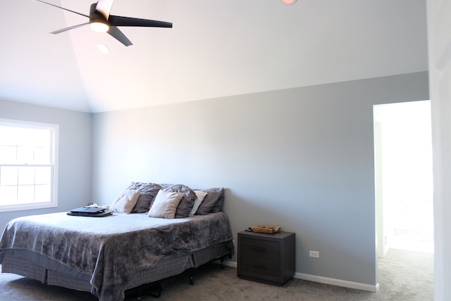 carpeted bedroom with vaulted ceiling and ceiling fan