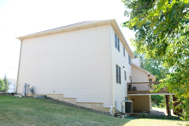 view of home's exterior featuring a yard and central air condition unit